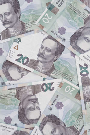 Paper money, Ukrainian hryvnia in denomination 20 hryvnia, new money, background with scattered banknotesの写真素材