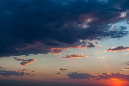 Reflections warm rays setting sun, swirls strong gust wind, outdoors. Bright blue sky, white...