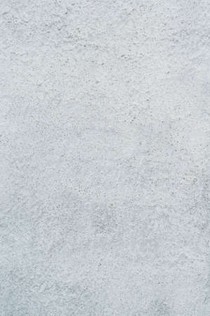 Texture applied tile adhesive on wall, ribbed concrete background close-up, building materialの写真素材