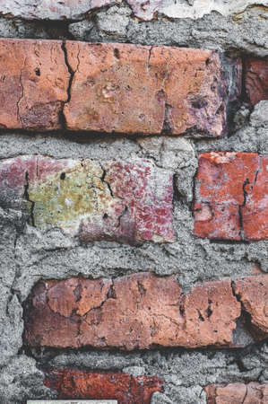 Grungy texture. Handmade red brick close-up, Background old surface, vintage cracked wallの写真素材
