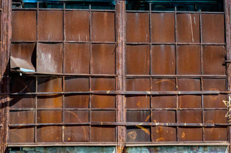 Background from old rusty metal sheets bonded to each other by argon weldingの写真素材
