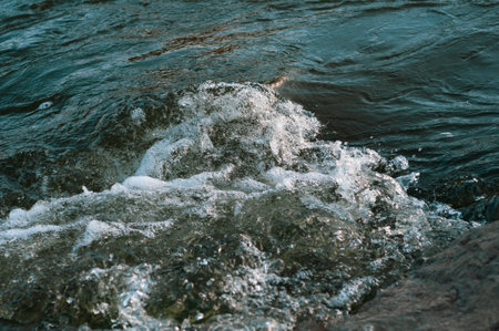 Rocky fast river. Running water, flowing with rapids, horizontal photo.の写真素材