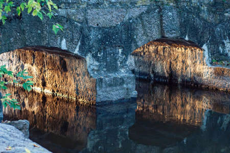Rocky fast river. Running water, flowing with rapids, horizontal photo.の写真素材