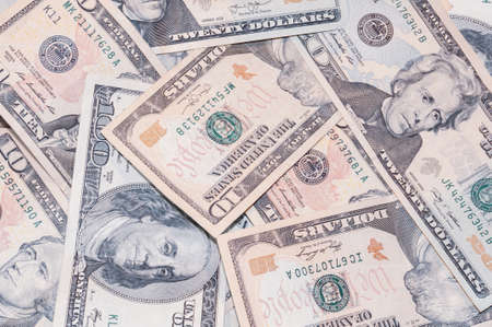 Close-up banknotes of 20 and 10 US dollars, top view. Cash exchange currency, business investment, background from banknotes. Successful banking, financial economicsの写真素材