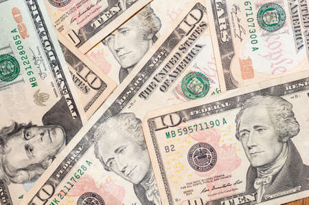 Close-up banknotes of 20 and 10 US dollars, top view. Cash exchange currency, business investment, background from banknotes. Successful banking, financial economicsの写真素材