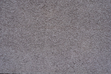 Dirty red grunge brick wall, peeling plaster, grungy texture of darkened brick.の写真素材