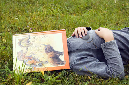 The boy reposes in green herbの写真素材