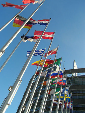 The flags of some countries on background blue sky.
