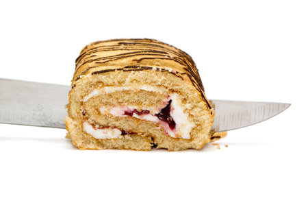 Swiss roll cut by slices isolated on a white background. 