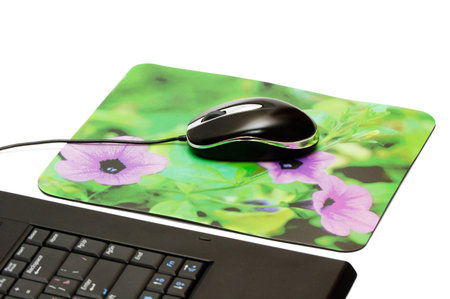 computer mouse and mouse pad isolated on a white background.