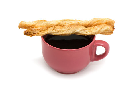 Cookies croissants and cup of coffee isolated on a white background.
