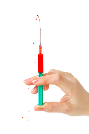 syringe and hand isolated on a white background  の写真素材