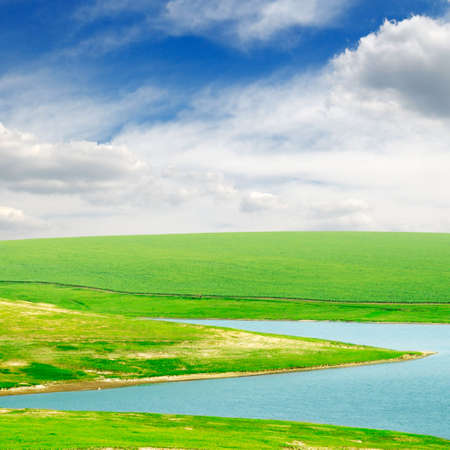 lake and green field                                    の写真素材