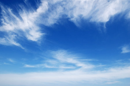 white fluffy clouds in the blue sky 
