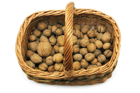 Wicker basket with nuts isolated on a white background                                     の写真素材