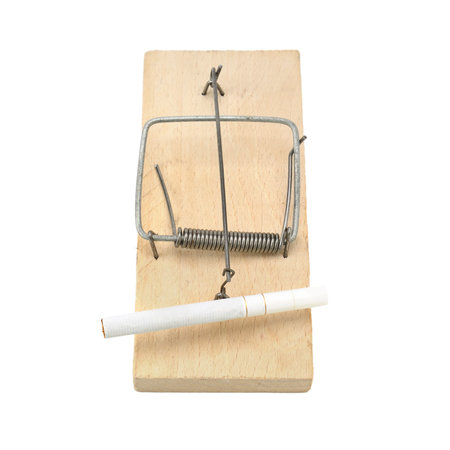 Cigarette in a mousetrap. Concept - the hazards of smoking.                                    