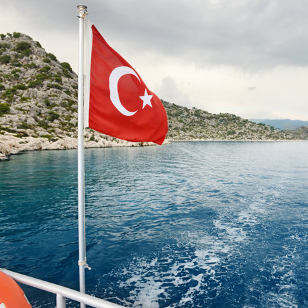 Turkish flag on a background of sea and skyの写真素材