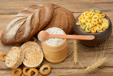 Products made of wheat on wooden table.の写真素材