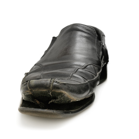 old shoe isolated on a white backgroundの写真素材