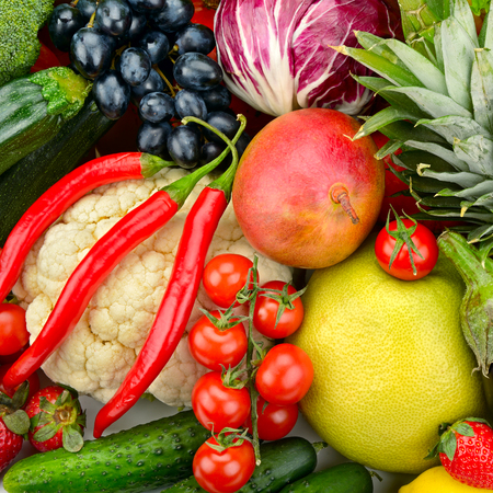 assortment fresh fruits and vegetables isolated on whiteの写真素材