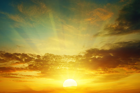 beautiful bright sunset in cloudy sky