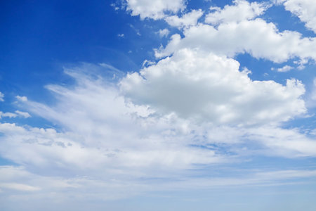 Light fluffy clouds against the blue sky.