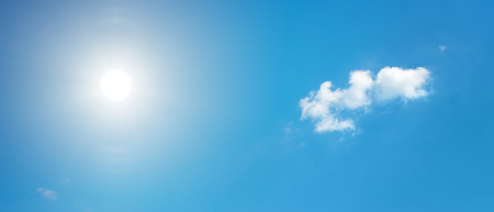 Bright sun in blue sky.の写真素材