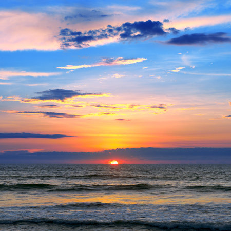 Sea landscape with fantastic beautiful sky and calm surf