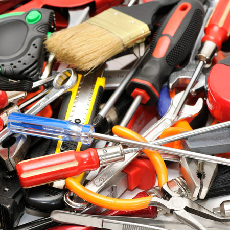 Large pile various hand tools