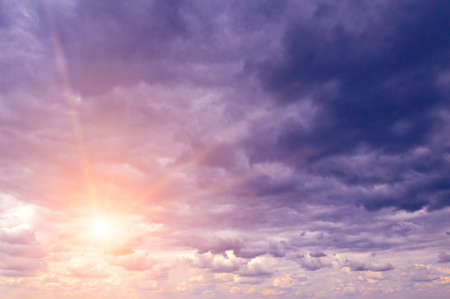 Bright majestic dawn against gray stormy sky.の写真素材