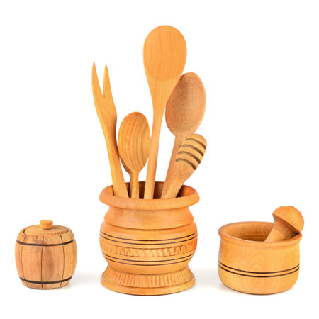 Kitchen wooden utensils (spoon, fork, pestle, mortar) isolated on white background.の写真素材