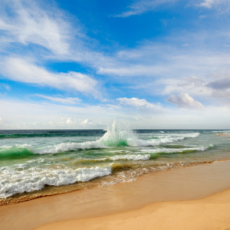 Beautiful surf on the picturesque sandy shore of the ocean.の写真素材