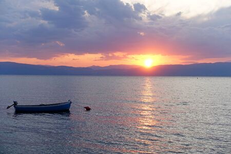 Beautiful sunset on the wonderful shore of Lake Ohrid in Northern Macedonia, and on the horizon of Albaniaの写真素材