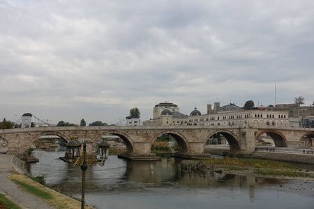 The ancient bridge over the Bardar River - the main attraction of Skopjeの写真素材