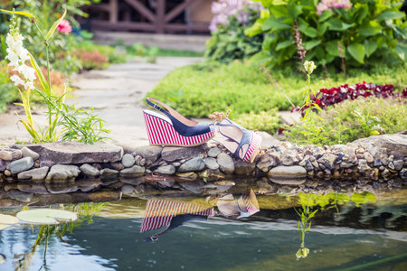 marine sandals lie beside the poolの写真素材
