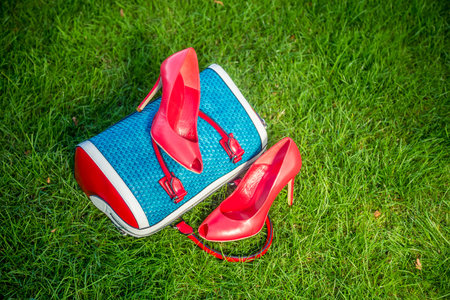 Women's shoes are on the bag and on the ground, women's summer shoesの写真素材