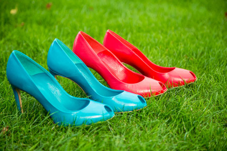 women's shoes in a row standing position on the grassの写真素材
