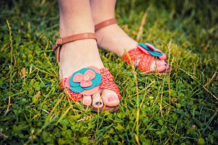 Sandals on the feet of the girlの写真素材