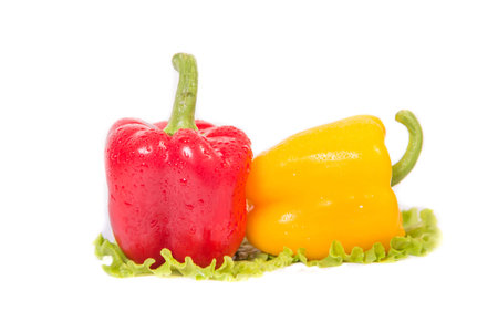 red and yellow peppers and a ball in her salad tooの写真素材