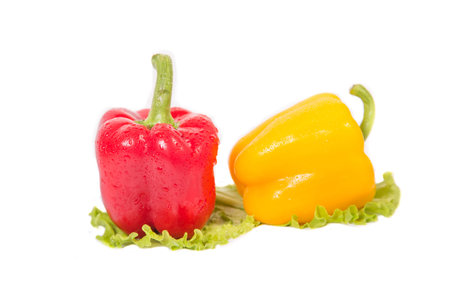 red and yellow peppers and a ball in her salad tooの写真素材