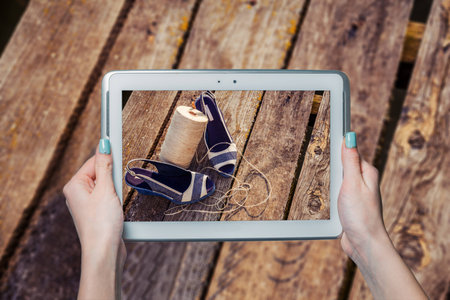 Online shoe store, she photographed sandalsの写真素材