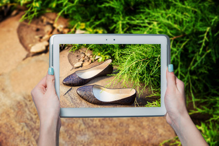 girl photographed shoes online saleの写真素材