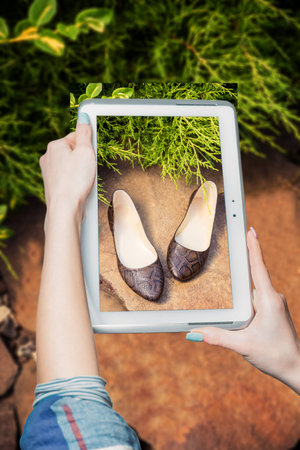 girl photographed shoes online saleの写真素材