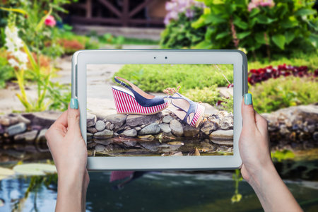 girl photographed shoes online saleの写真素材