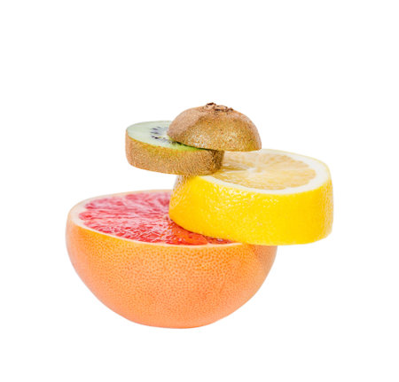 The pedestal of the fruits falling fruit, balance, grapefruit, kiwi, lemonの写真素材