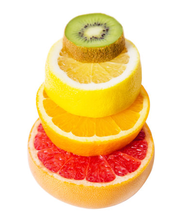 The pedestal of the fruits falling fruit, balance, grapefruit, kiwi, lemonの写真素材