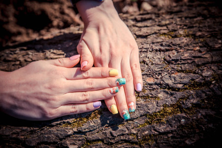 manicure on a background of tree barkの写真素材
