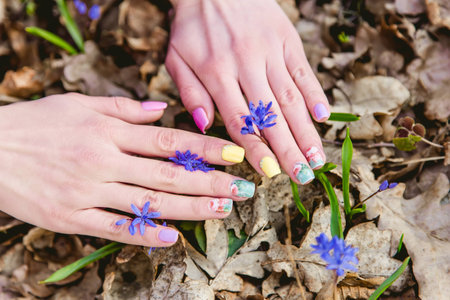 manicure on a background of flowersの写真素材