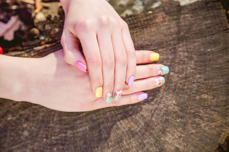 manicure on a background of cut woodの写真素材