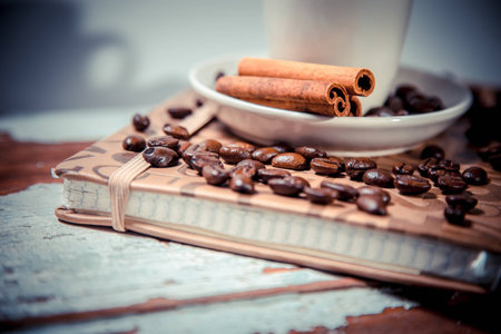 cinnamon and spillage of coffee beansの写真素材